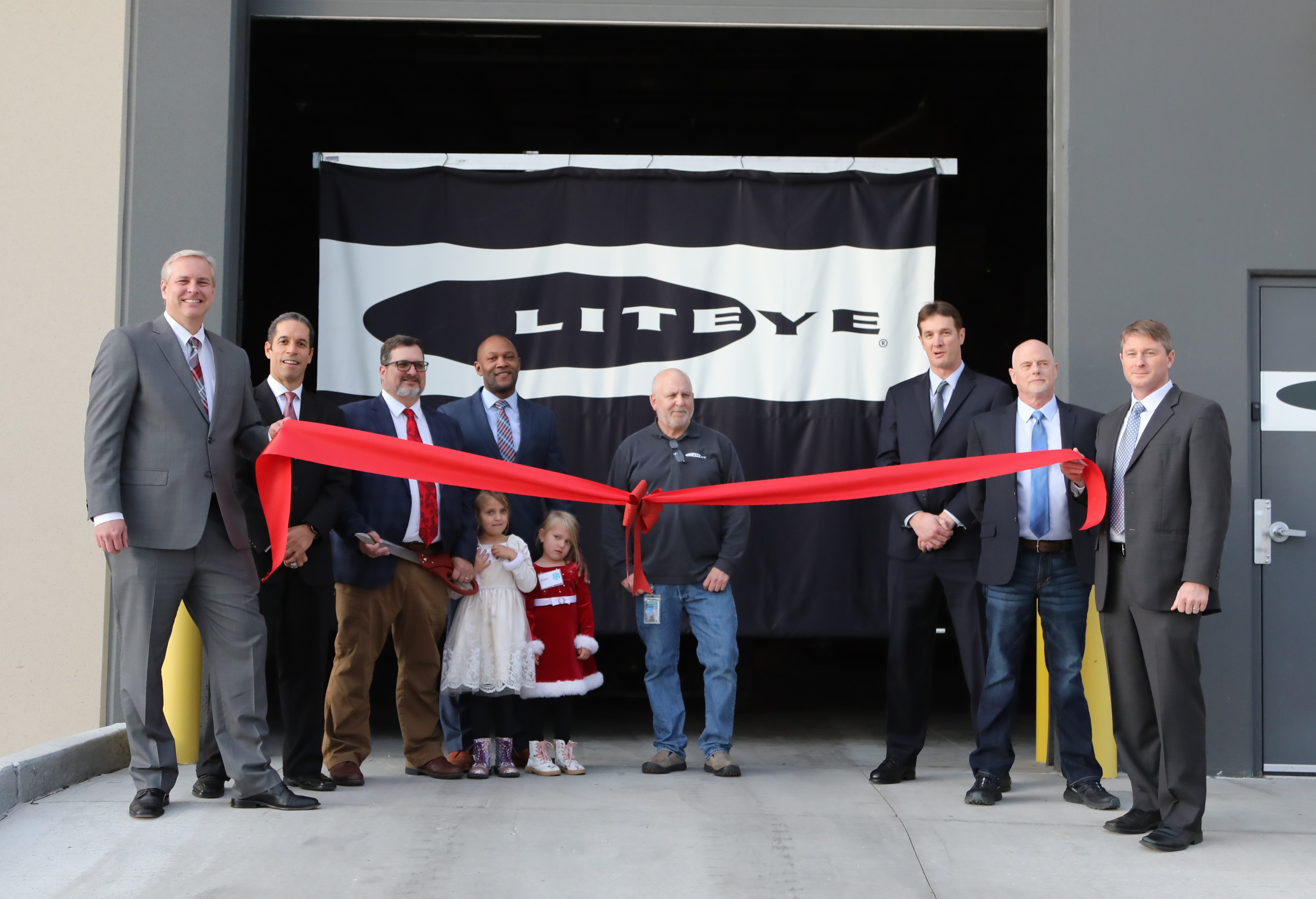 Liteye Systems Ribbon Cutting – Pictured from Left to Right (Executive Team):
Derek Newsom, Chief Operating Officer, Scott McClean, Government Relations, Kenneth Geyer, Chief Executive Officer and Co-Founder, (Kenneth Geyer’s Daughters), Jamie Chief Procurement Officer, Tom Scott, Chief Technology Officer and Co-Founder, Zac Neumayr, VP of Strategic Accounts, Rick Sondag, VP of Operation, Ryan Hurt, VP of Business Development
