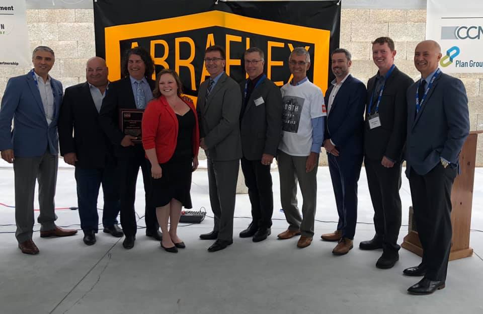 From left to right: Robert De Bartolo (OPG), Larry Miller (MP for Bruce–Grey–Owen Sound), Mike Ruysseveldt (Abraflex), Desiree Norwegian (Abraflex), Hon. Bill Walker (Minister of Government and Consumer Services, MPP for Bruce–Grey–Owen Sound), John Bradley (Abraflex), Ron Oberth (OCNI), Darryl Spector (Promation), Steve Hammell (Mayor of Arran-Elderslie), Mike Rencheck (Bruce Power)