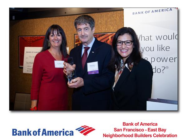 Swords to Plowshares Executive Director Michael Blecker (center) accepting this year's Neighborhood Builders award from Bank of America. 