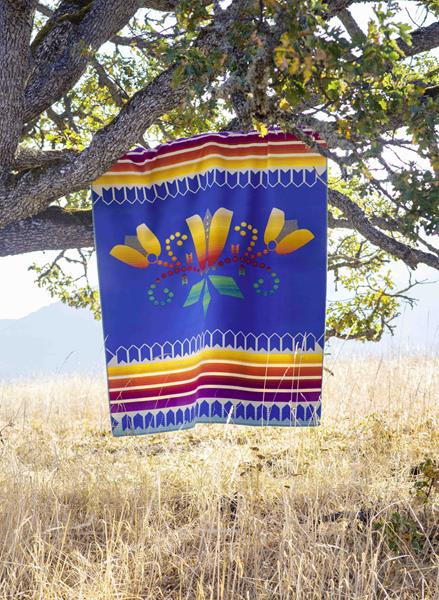 The Courage to Bloom blanket, which is available for purchase in Pendleton’s American Indian College Fund Blanket Collection.