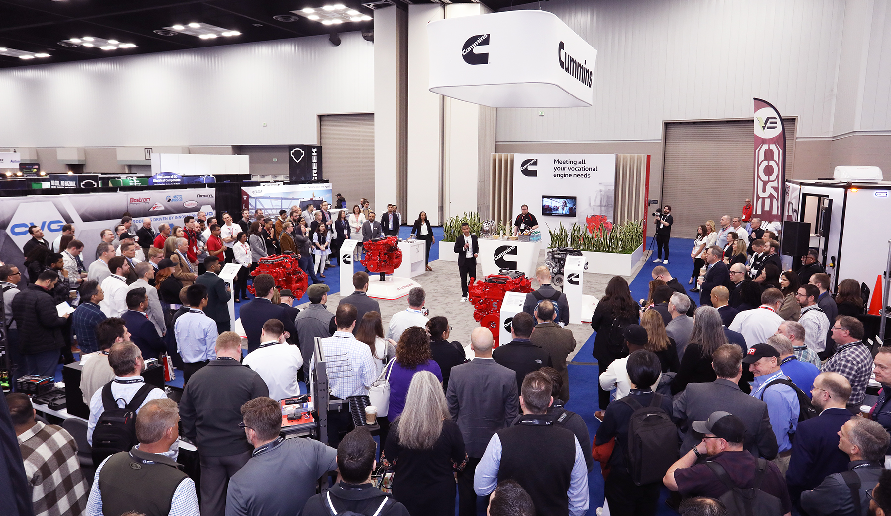 Large crowd around Cummins Work Truck Show booth for B7.2 diesel engine launch
