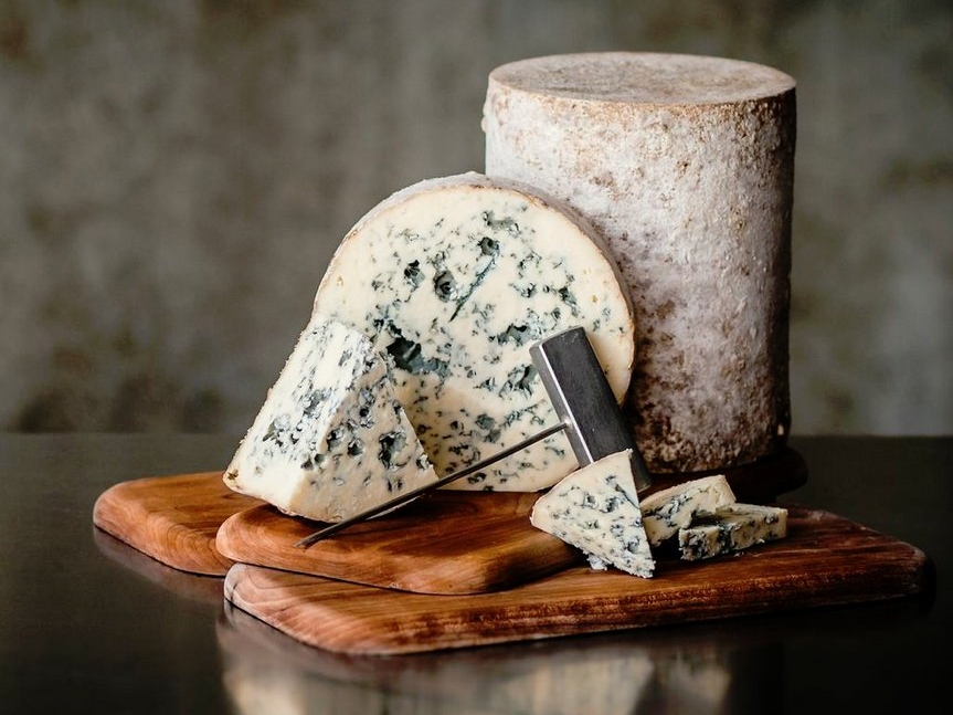 Bayley Hazen Blue, a raw-milk, natural rind blue with a semi-firm texture that becomes creamy on the palate, with notes of sweet cream, toasted nuts, and subtle anise spice. 