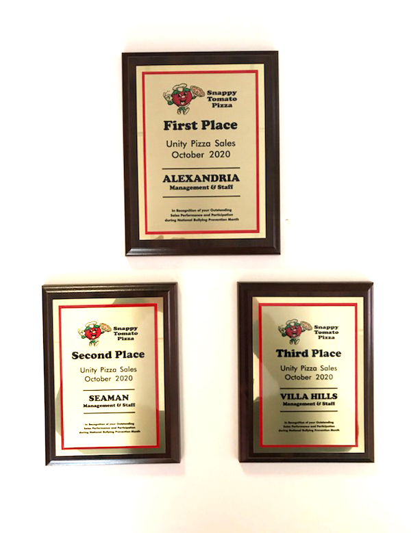Award Plaques – First Place Alexandria, Kentucky’s Snappy Tomato Pizza

“Add Cheddar and Make It Better” - Snappy Tomato Pizza raised $5,818.  We added cheddar cheese to represent the color of Unity Day and each $1 was donated to PACER’s National Bullying Prevention Center.   First Place – Alexandria, Kentucky | Second Place – Seaman, Ohio | Third place – Villa Hills, Kentucky.
Visit SnappyTomato.com/UnityPizza for more information. 
#SnappyTomato
