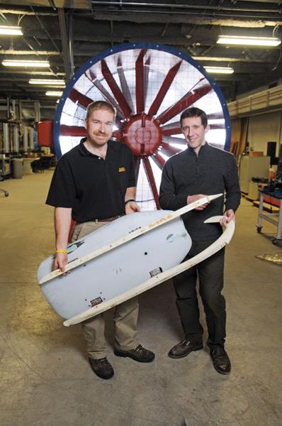 Left to Right: Professors Doug Bohl and Brian Helenbrook post with a luge prototype.