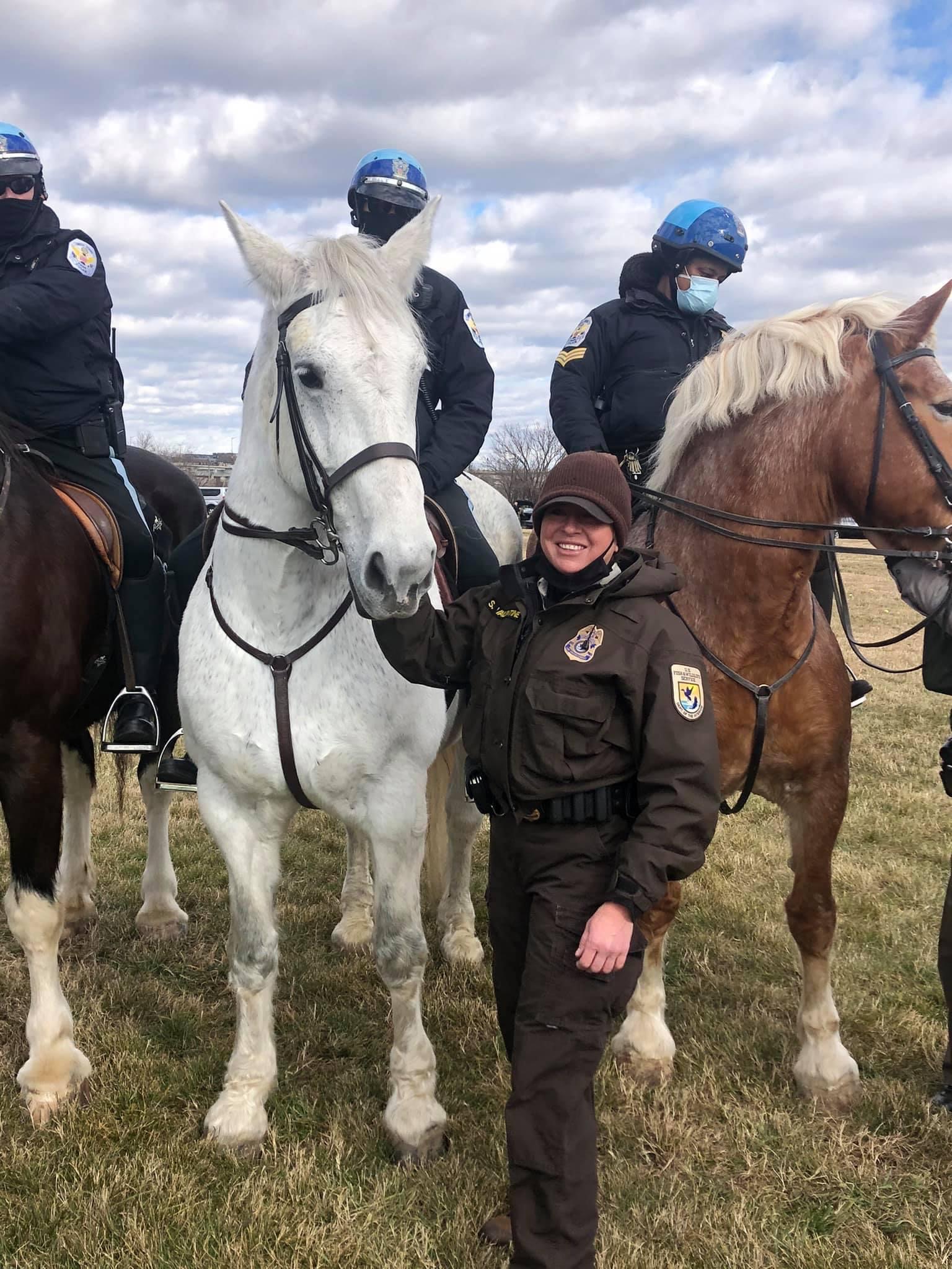 Member of U.S. Fish and Wildlife Service Holds Horse