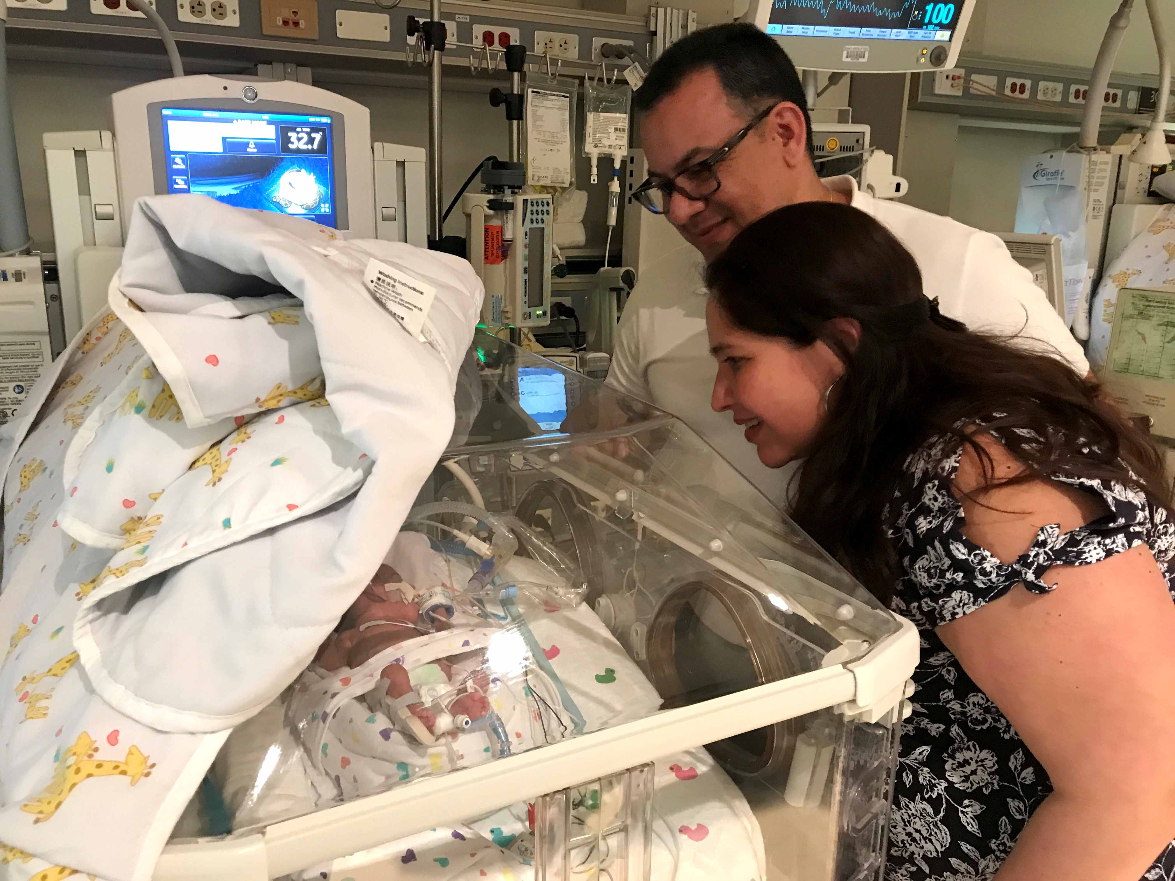 Siddhartha Rodriguez and Jesus Romero visit baby Amanda in the NICU at The Woman's Hospital of Texas.