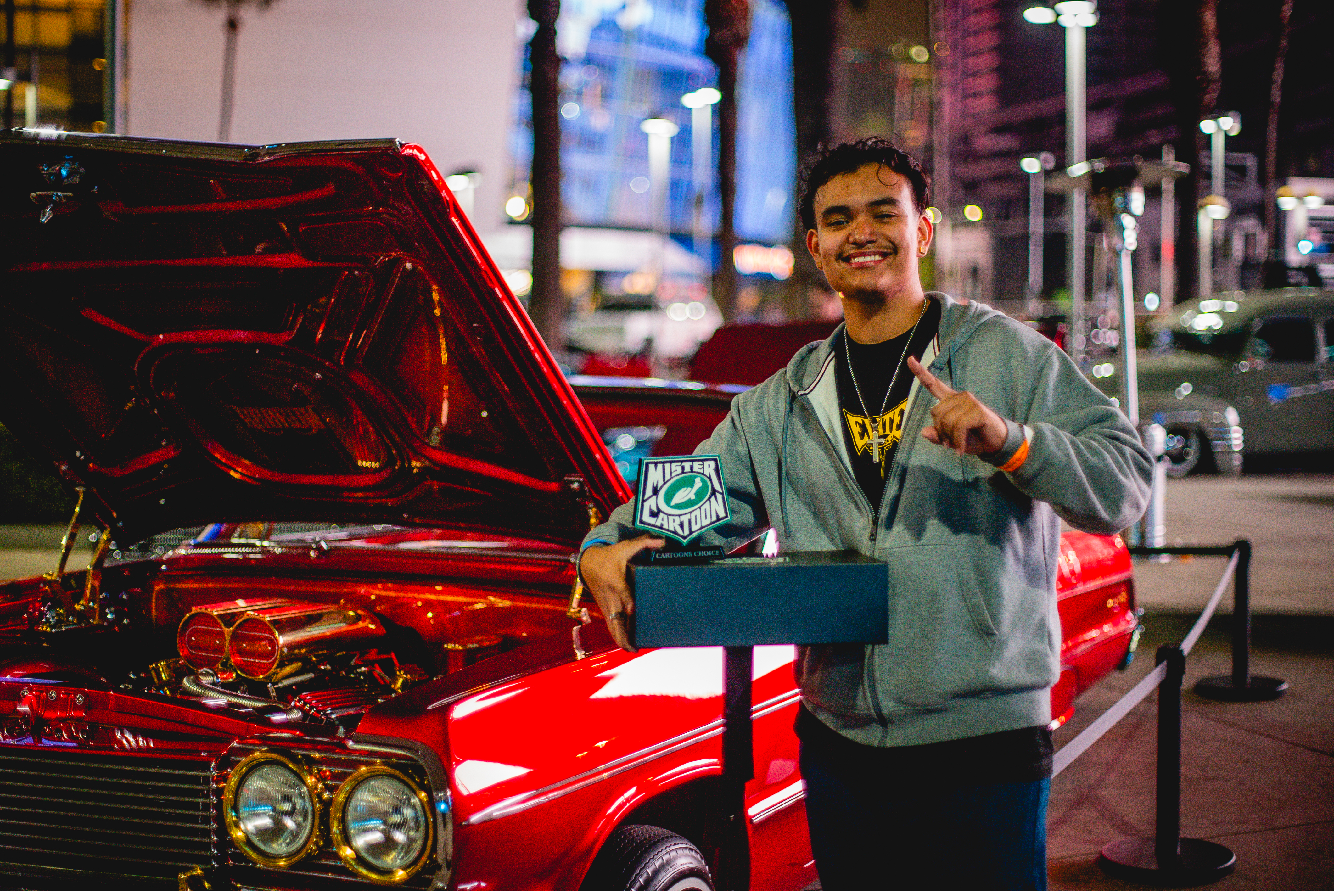 Celebrating victory! Andrew De Alba proudly holds the trophy for his award-winning car, Redrum, at Turtle Wax x Mister Cartoon's Art of Car Care Invitational held on November 23rd. The event, curated by the renowned Mister Cartoon and Turtle Wax and featuring 30 vehicles, showcased the creativity and craftsmanship of LA's car culture and celebrated the Art of Car Care line's first anniversary in the U.S. The line is available at O'Reilly Auto Parts nationwide in stores and online at OReillyAuto.com.