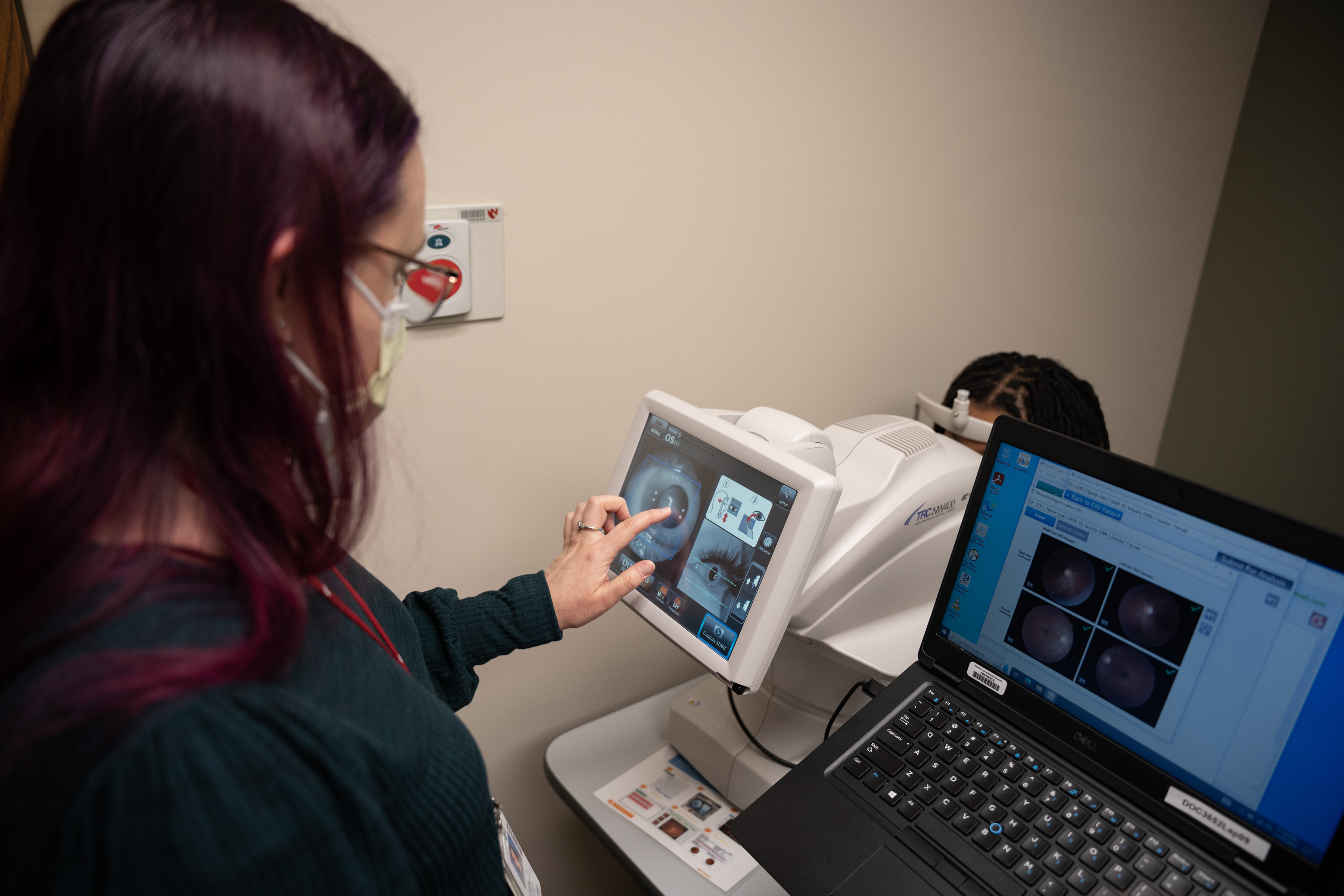 A patient is tested for eye disease with the EyeArt AI Eye Screening System