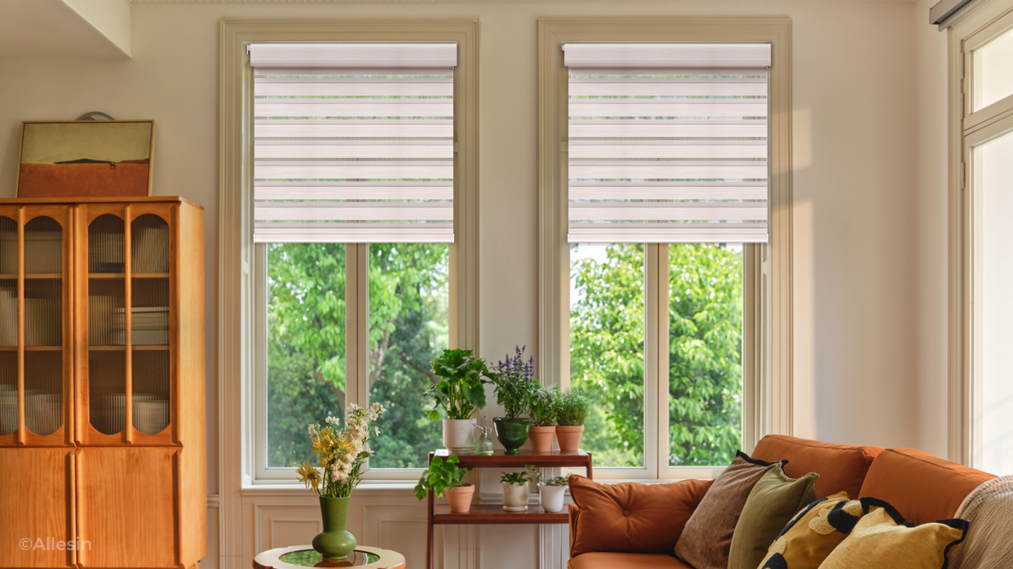 Allesin curtains installed in two windows of a living room