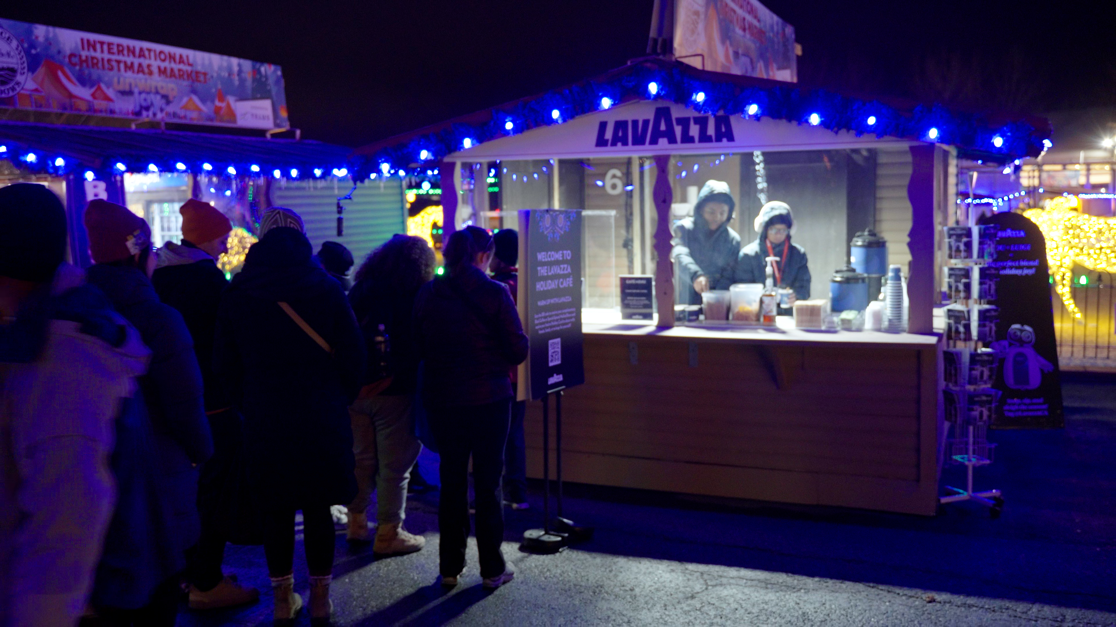 Visitors line up at the Lavazza Holiday Café at Spruce Meadows International Christmas Market for warm seasonal coffee.