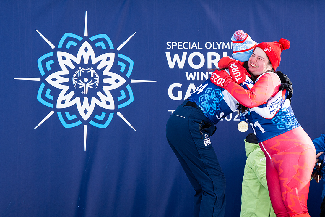 Alpine skiers Claire Potter (Special Olympics USA) and Jessica Larivée (Special Olympics Canada) share a heartfelt embrace. Potter leaves Turin with a gold and a silver, while Larivée takes home a silver medal.Photo by: Pablo Dondero