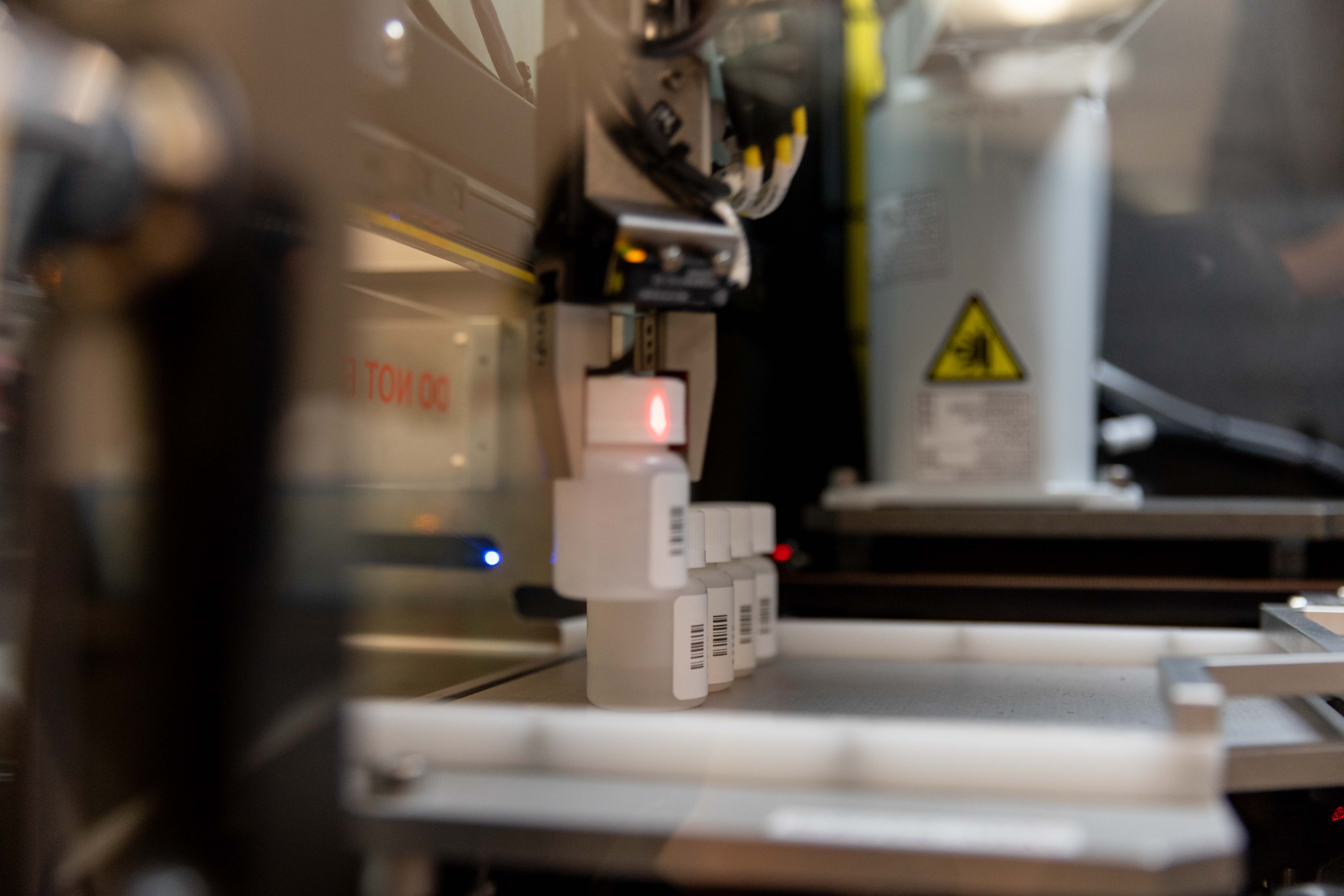 The ZING system's automated bottle-handling mechanism processes labeled medication bottles at Comprehensive Healthcare's Yakima clinic.