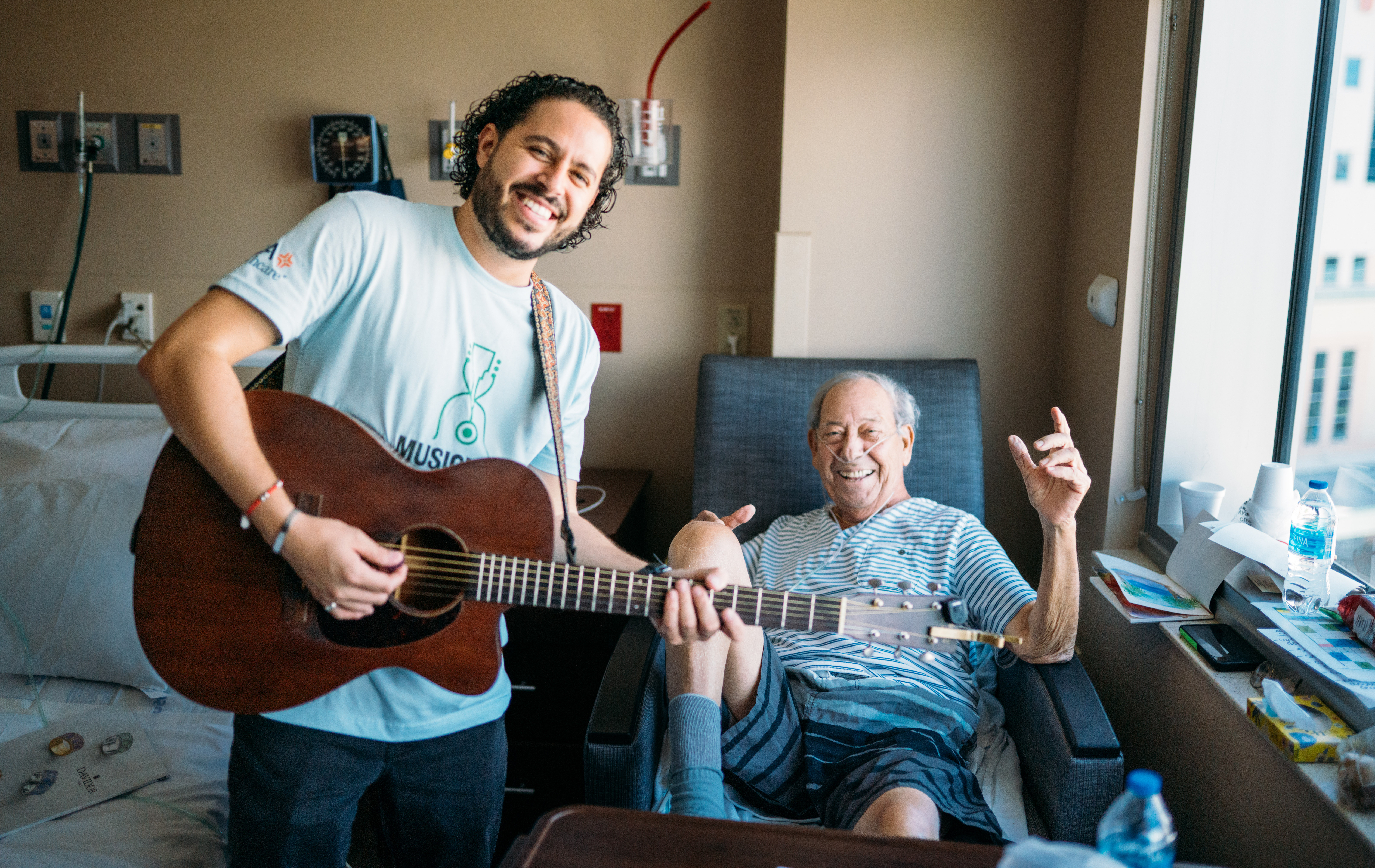 Volunteer Musician Bryant Del Toro performs for patients at HCA Florida Aventura Hospital during the Musicians On Call Bedside program.