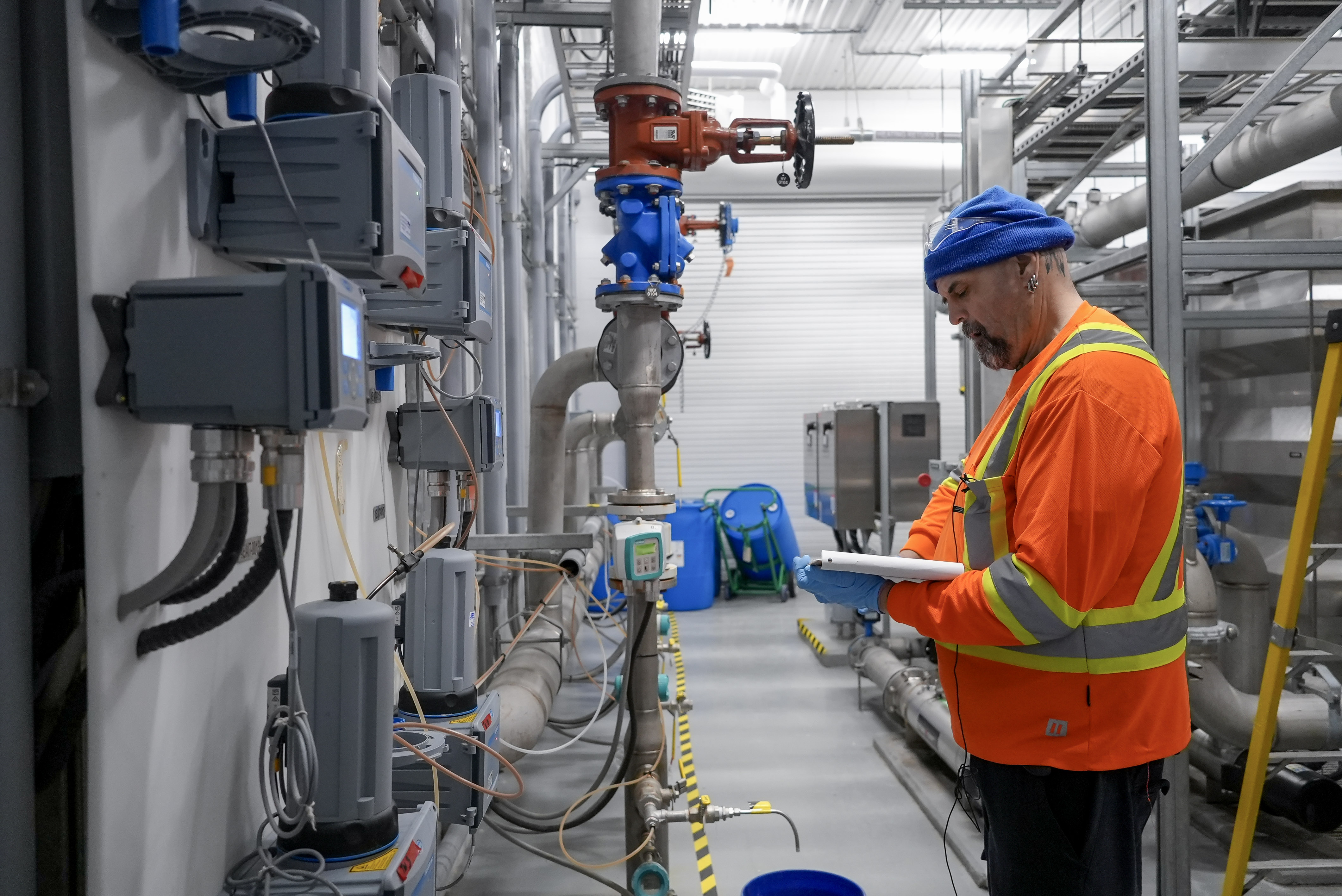Water First Graduate working at their local water treatment plant