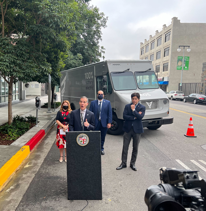Mayor of LA Eric Garcetti speaking in front of an Xos electric vehicle at the California Clean Air Day event on Wednesday, October 6th
