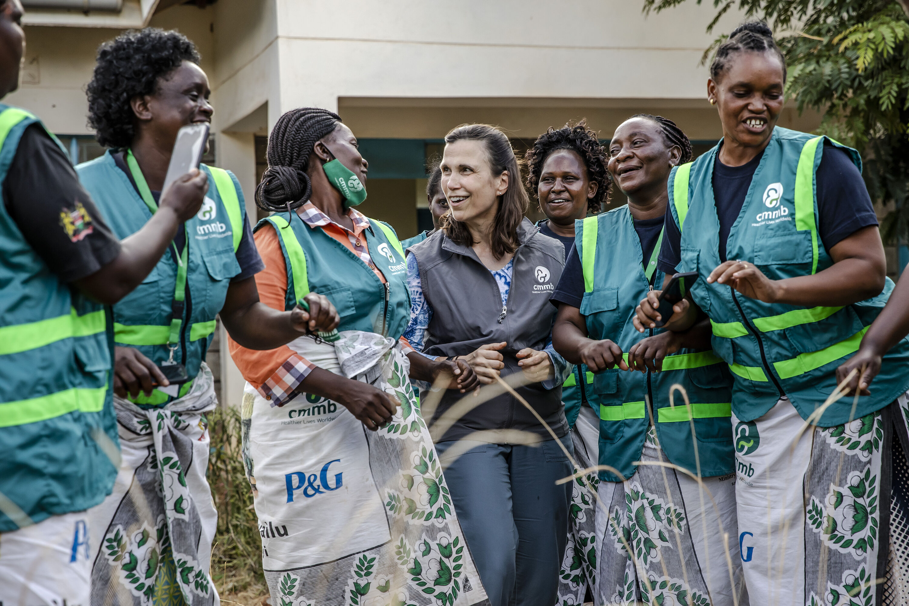 Mary Beth Powers, CMMB President and CEO, with Community Health Workers