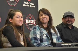Mayah Zamora (left) speaks to news media as her parents, Christina and Ruben, look on. Mayah Zamora, a survivor of the shooting at Robb Elementary School in Uvalde, Texas, in May 2022, met three of the donors who gave some of the blood she received during emergency treatment. The meeting took place during the fifth anniversary celebration of the Heroes in Arms program, held at South Texas Blood & Tissue on Jan. 28. Heroes in Arms supplies emergency responders with blood that can be transfused to any patient in emergency trauma situations.