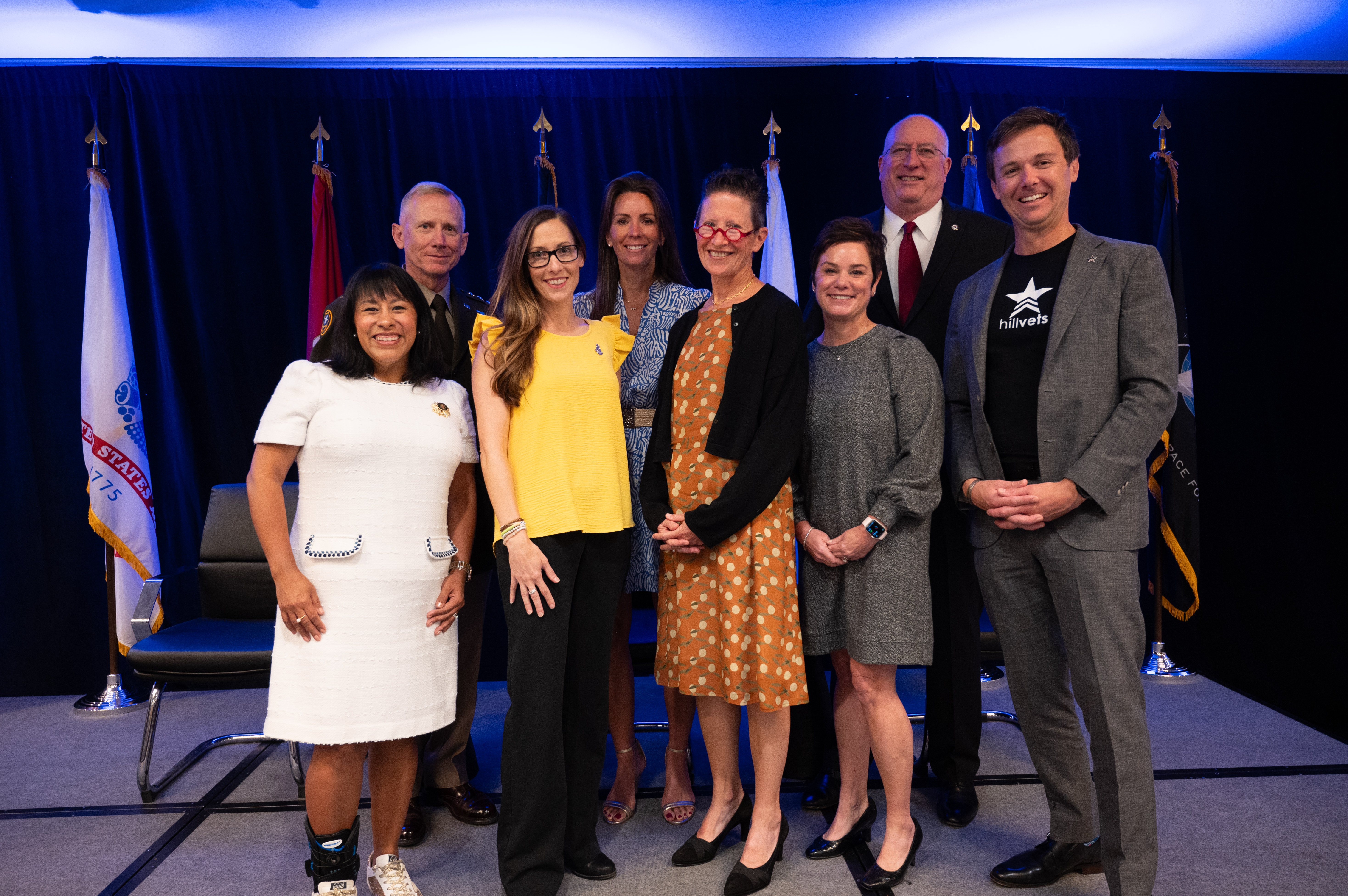 Recipients of the 2024 Fisher Service Awards stand with Lt. Gen. Douglas A. Sims, II Director for the Joint Staff; Kelly Facer for Military Times Foundation, and David A. Coker, President of Fisher House Foundation.