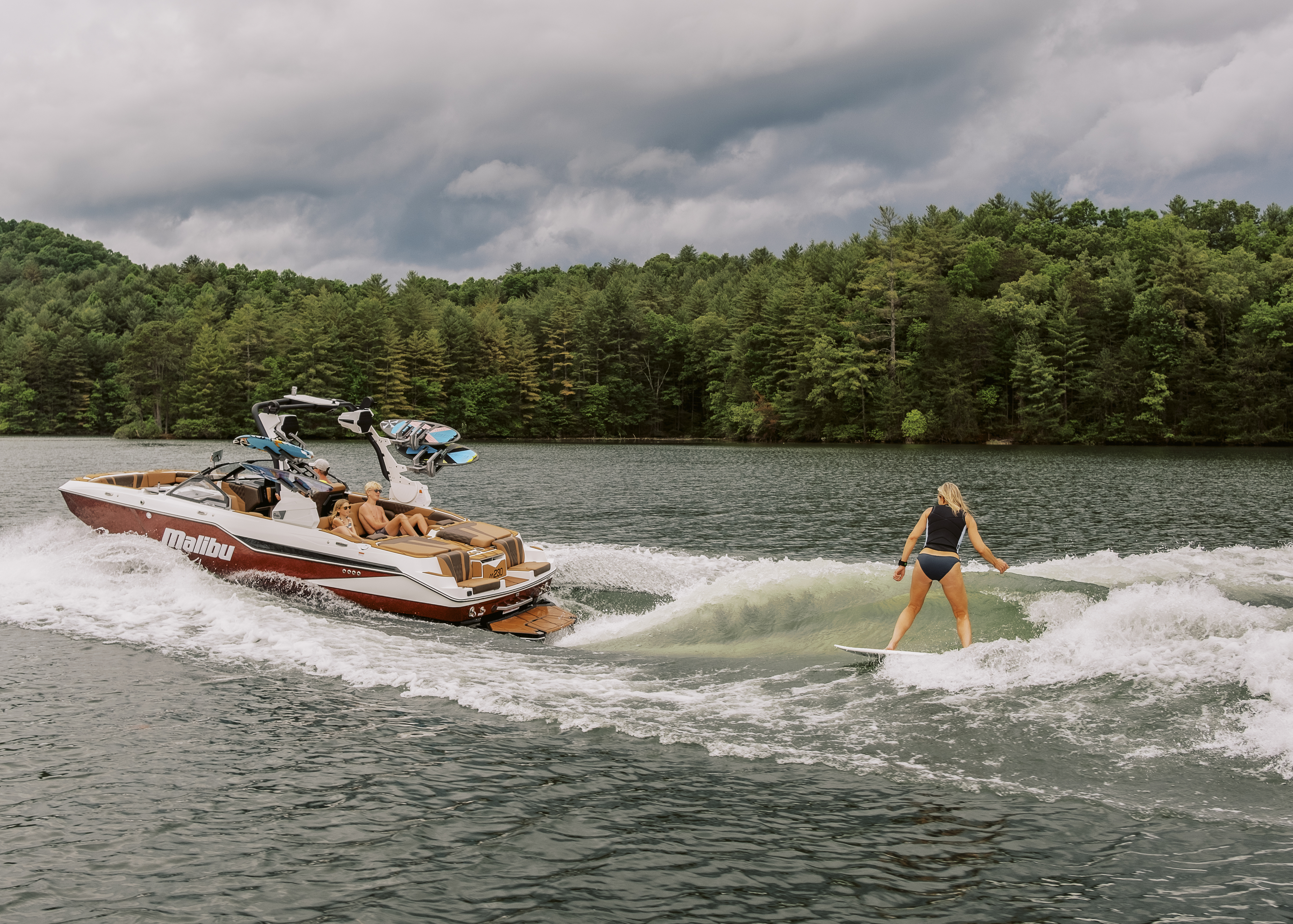 Malibu Pro Stacia Bank rides her boat of choice, the M230, carving through a clean wave sculpted by Malibu’s Surf Gate™ and Power Wedge® III.