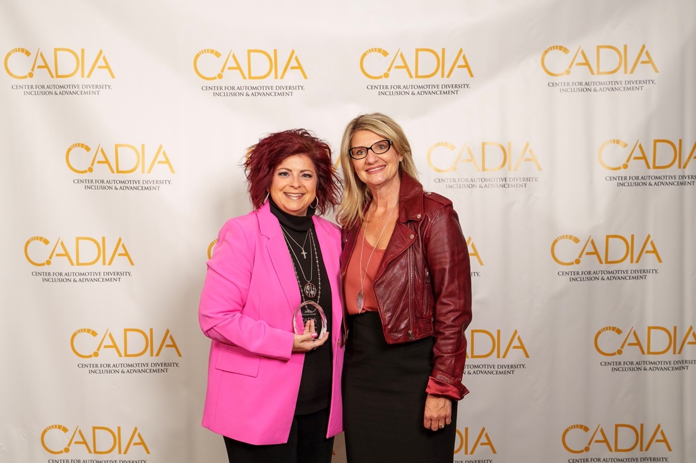 Deanna Lorincz, Global Director Communications and Marketing accepts the 2023 CADIA Impact Award receiving overall recognition in the category of Leadership Commitment. Photo Credit: CADIA/Nadir Ali