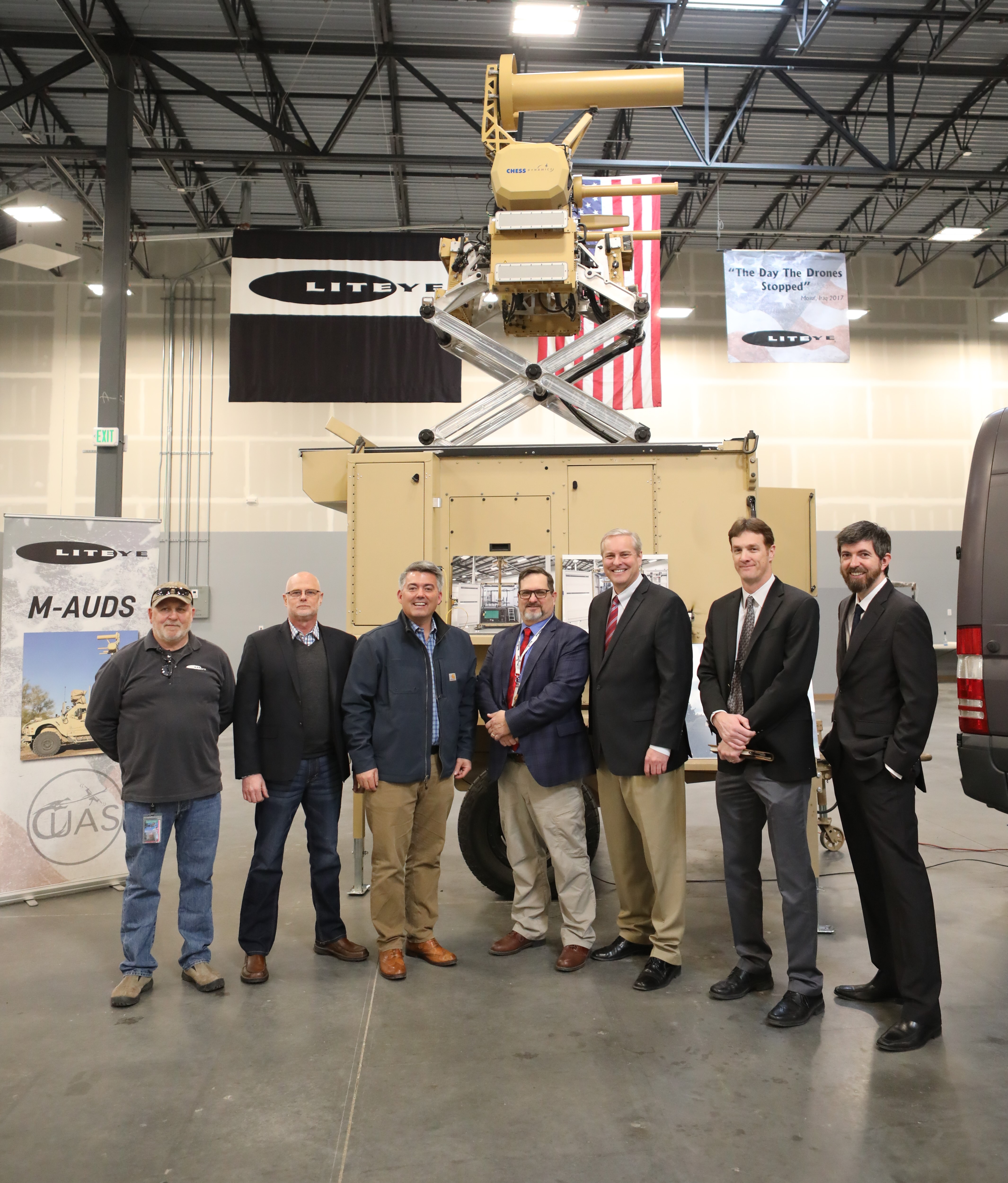 Pictured from left to right are: Tom Scott, CTO/Co-Owner Liteye Systems, Rick Sondag, VP Liteye Systems, Senator Cory Gardner, Kenneth Geyer, CEO/Co-Owner Liteye Systems, Derek Newsom, COO Liteye Systems, Zac Neumayr, VP Liteye Systems, Nate Knight, VP Numerica (Background is Liteye's new T-AUDS systems that was recently deployed in the Colorado "Drone Mystery" investigation.)