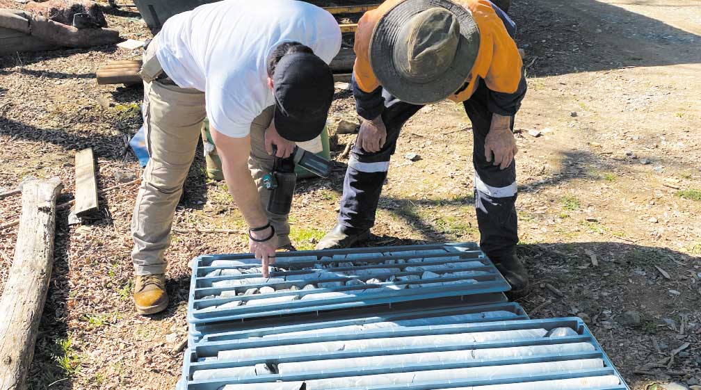 Phil Thomas, President and Denis Walsh, Chief Geologist inspect the drill core before shipping off to Trentham.