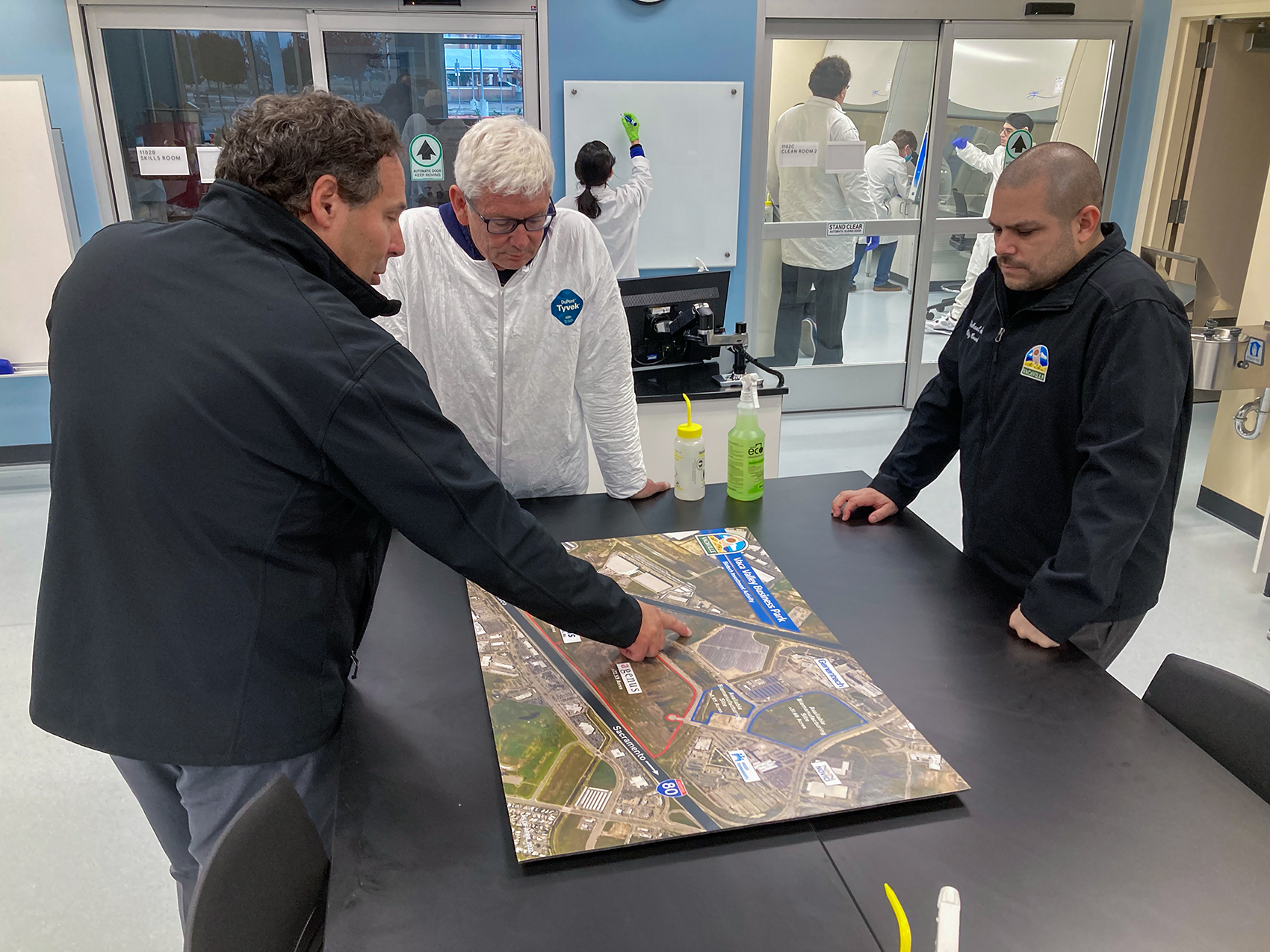 Professor DeKloe, Vacaville City Councilmember Michael Silva and Vacaville City Manager Aaron Busch review map of Vacaville's Vaca Valley Business Park.  Nearly all of the vacant parcels have been purchased, with the exception of two.
