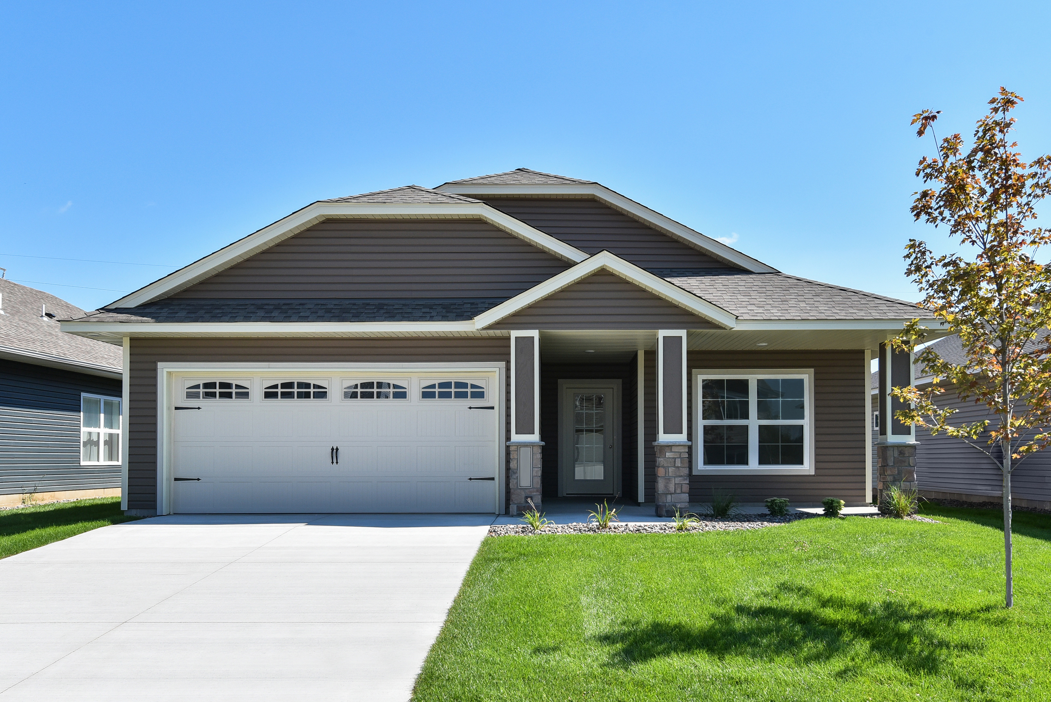 The St. Timothy is a single-story home with two bedrooms, two bathrooms, an open entertaining space and cozy enclosed porch with a fireplace.