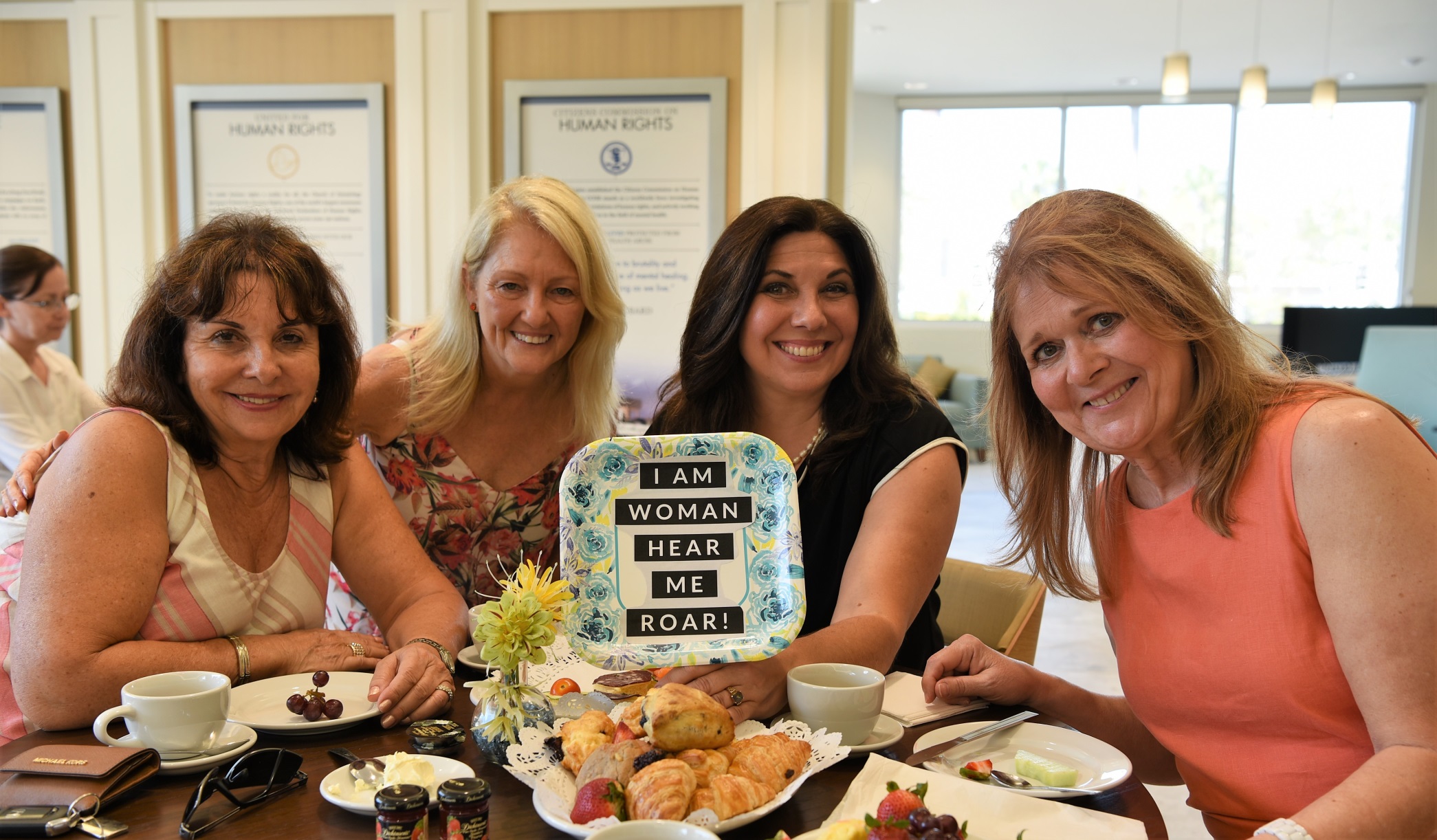 Tea Party Guests with Sign