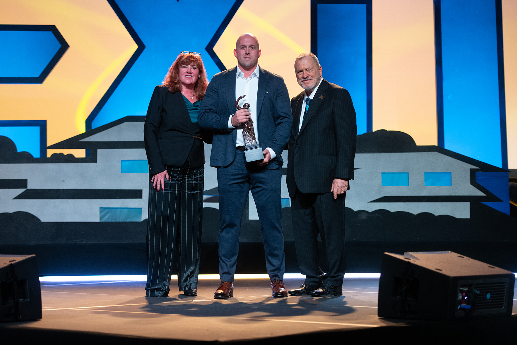 From L/R: EXIT Realty Co-Chair, Tami Bonnell, Sales Representative, Kyle Johnson, and Founder and Chairman, Steve Morris.