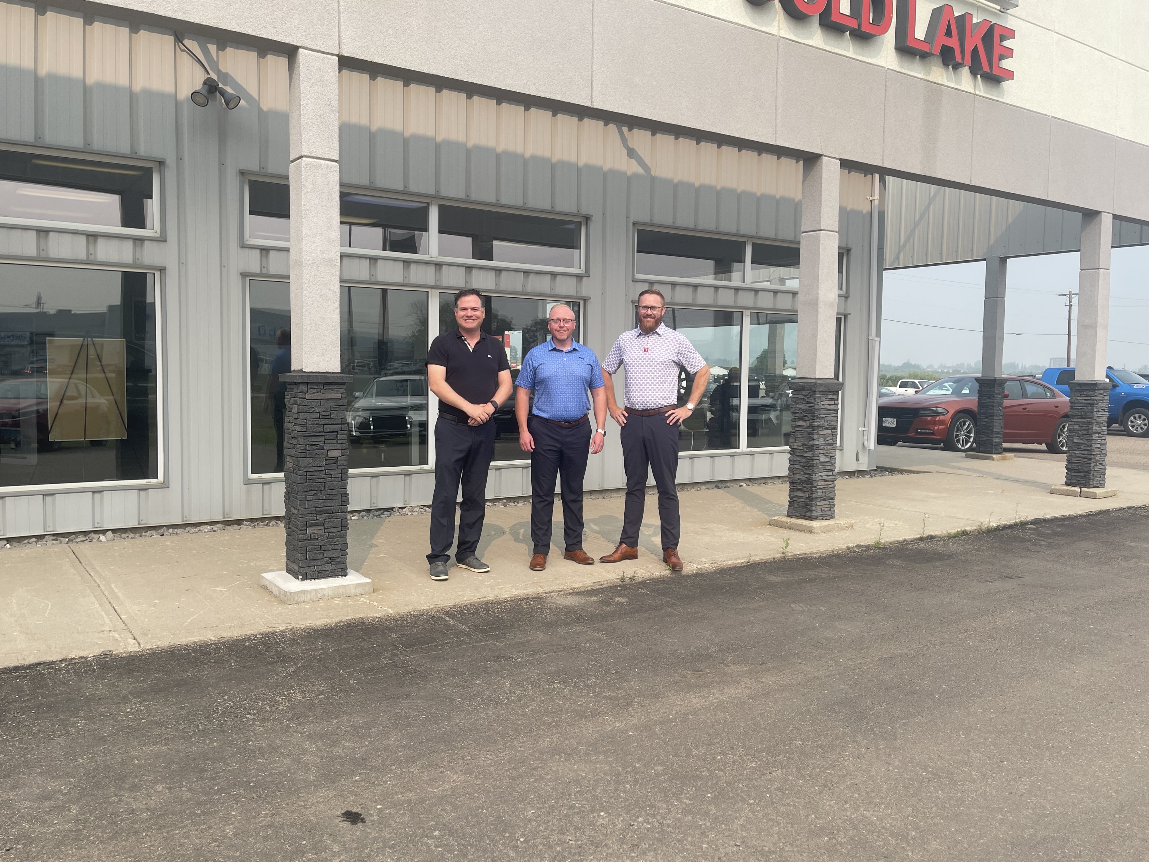 Brian Brouse with the Tim Lamb Group stands with Spencer and Darren at the closing of Kia Cold Lake on July 23, 2024.