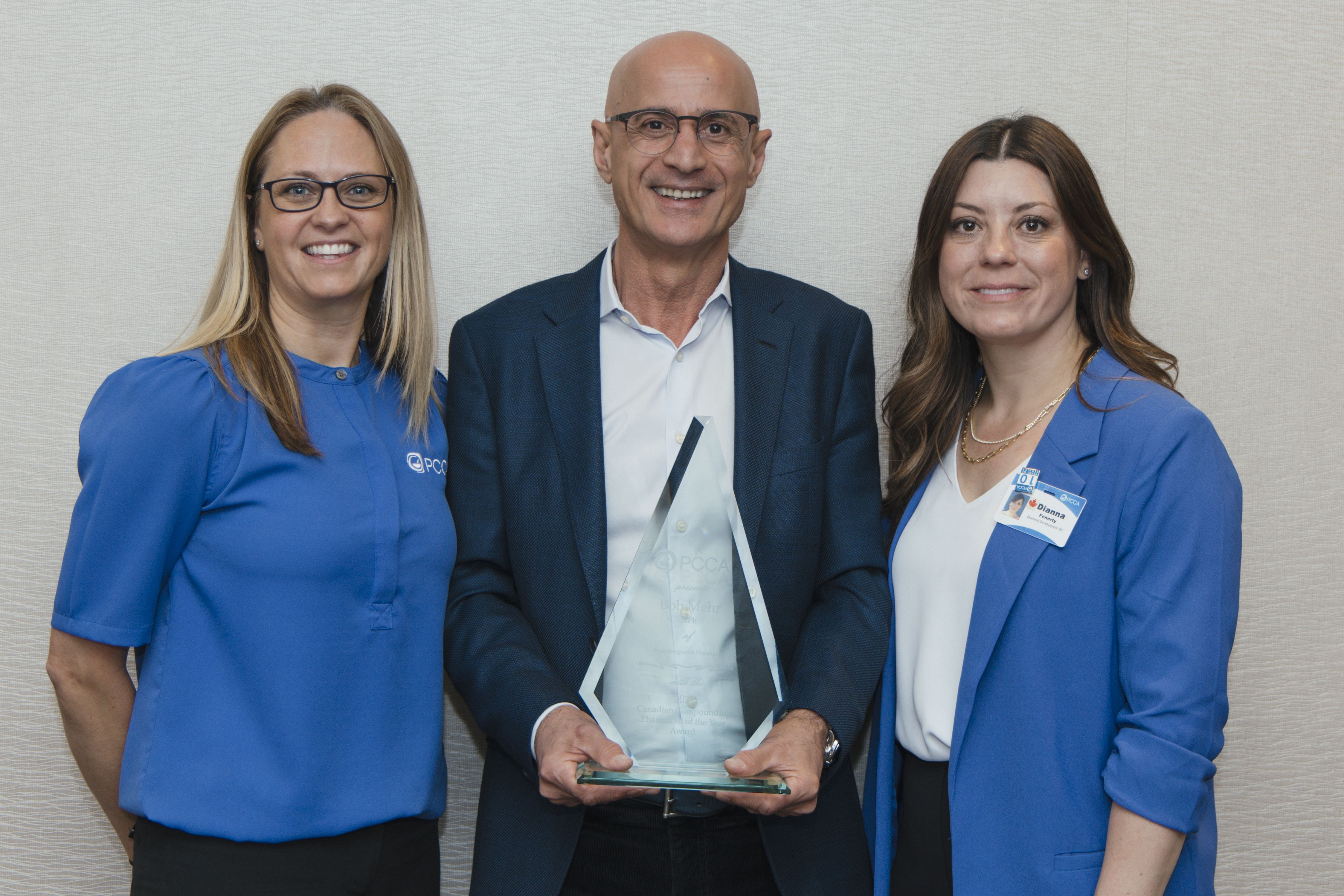 Bob Mehr receives the 2024 Canadian Compounding Pharmacist of the Year award from PCCA Canada's General Manager Amanda Cassel (left) and Dianna Fenerty.