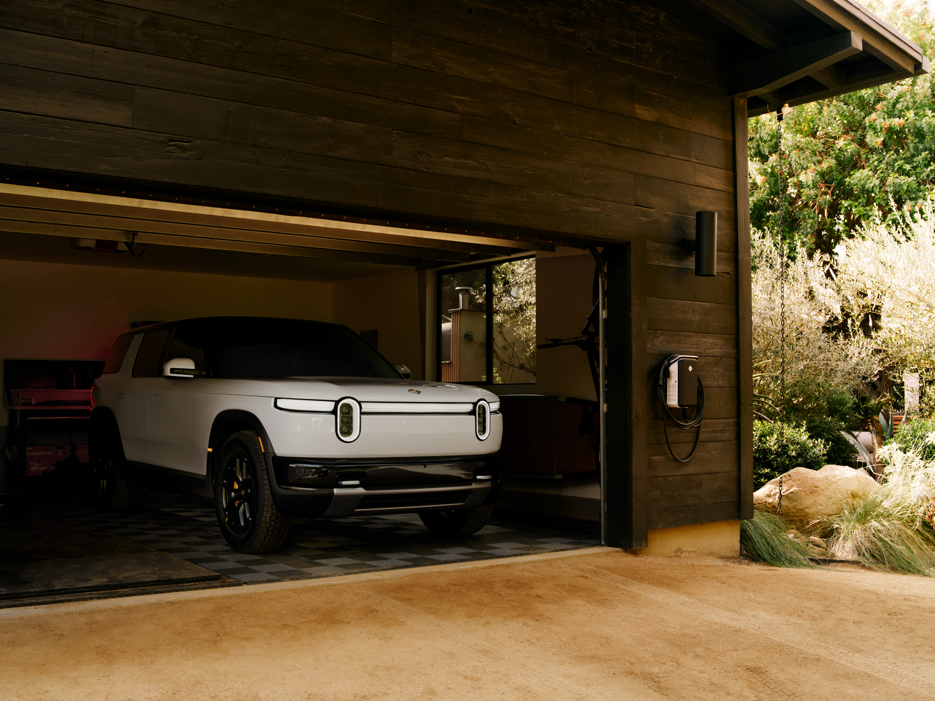 ChargeScape official image of a Rivian R2 charging at home