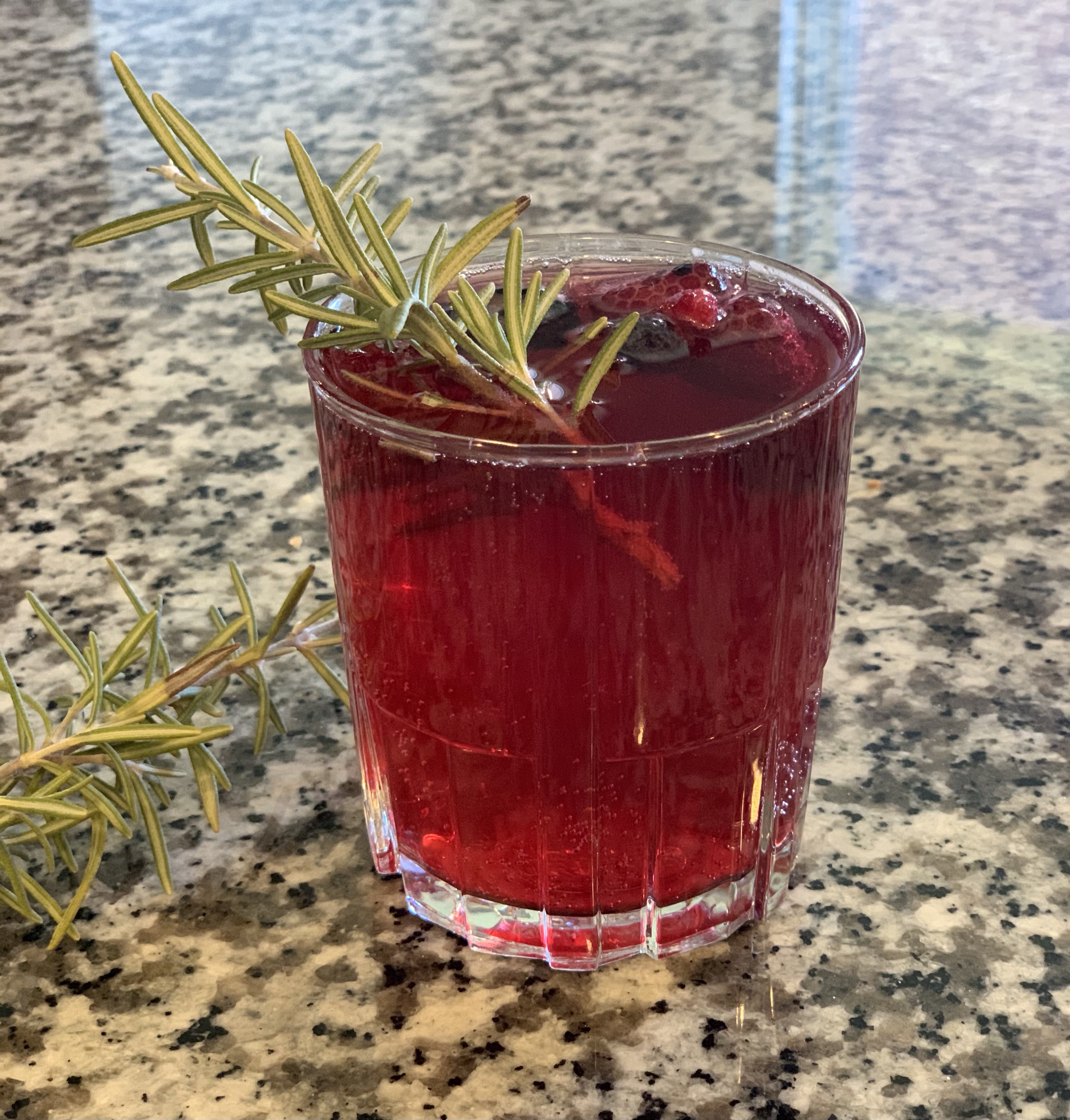 To make the Berry & Rosemary Fizz  add 2-ounces of cooled infused syrup and 1-ounce of club soda to a shaker filled with ice. Shake to chill. Strain into a Duralex Jazz Tumbler and fill glass with Prosecco. Garnish with a few berries and a sprig of rosemary.