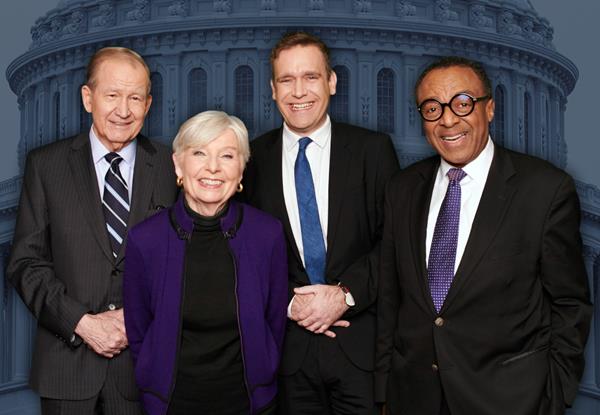 The McLaughlin Group team - Series host Tom Rogan (center right) and longtime panel members (left to right) Pat Buchanan, Eleanor Clift, and Clarence Page.  