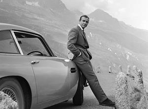 Sir Sean Connery during the filming of Goldfinger with one of the movie cars