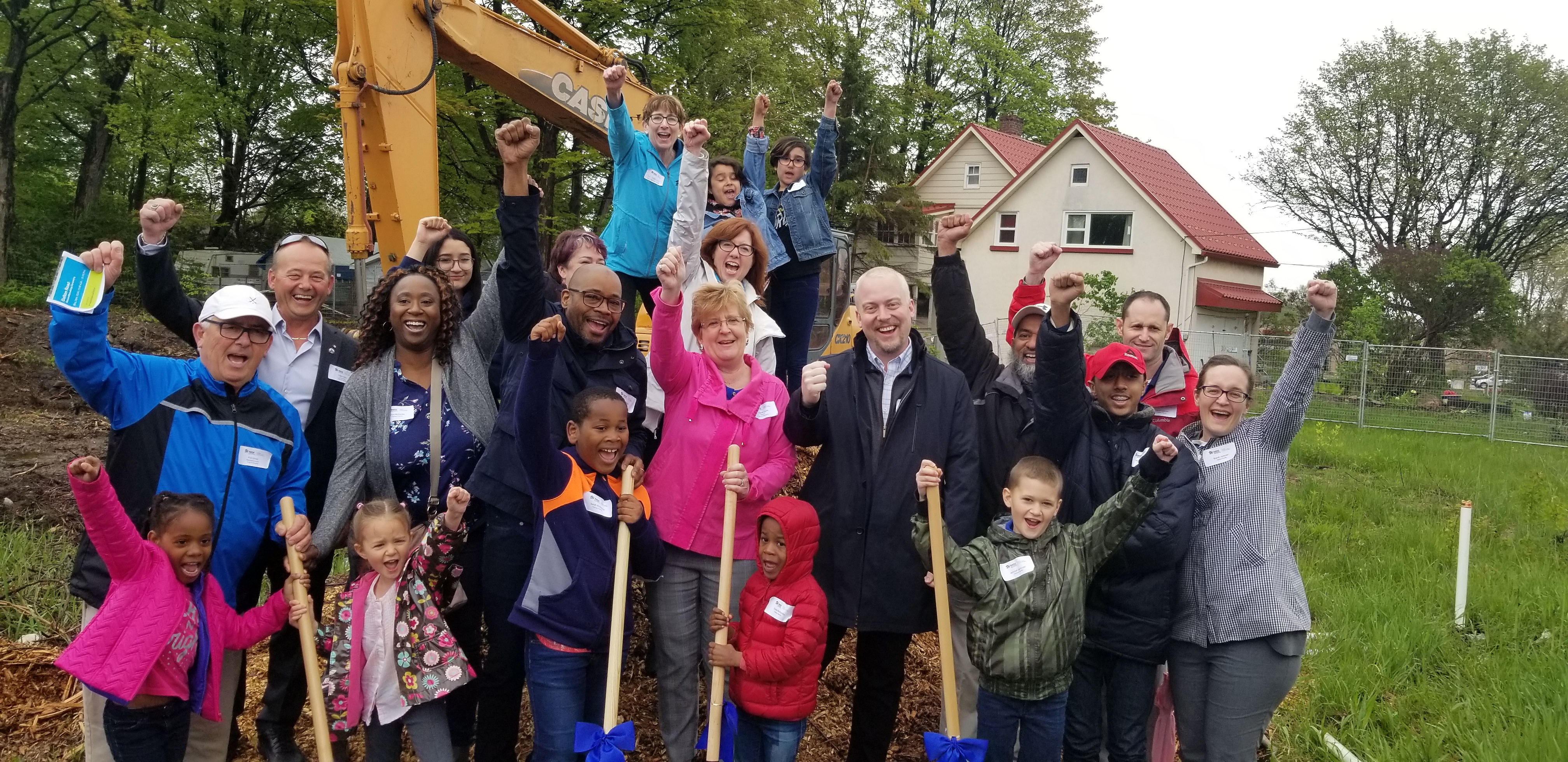 The photo was taken at the conclusion of the Ceremony. 

Members include Ene Underwood, CEO of Habitat for Humanity Greater Toronto Area, Frank Sebo, Councillor for Ward 4, Christine Pacini, Board Chair of Habitat for Humanity Greater Toronto Area, Robert Grossi, Regional Councillor, Mayor Margaret Quirk, Town of Georgina, Mike Waddington, Councillor Ward 1 and future Habitat homeowners (parents and children) at the Dalton Road build project.