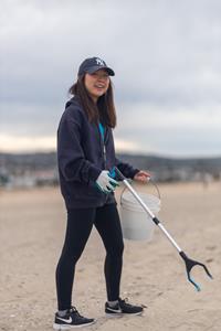Girl cleaning up beach