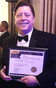 Chris Nolan with The M&A Advisor Award