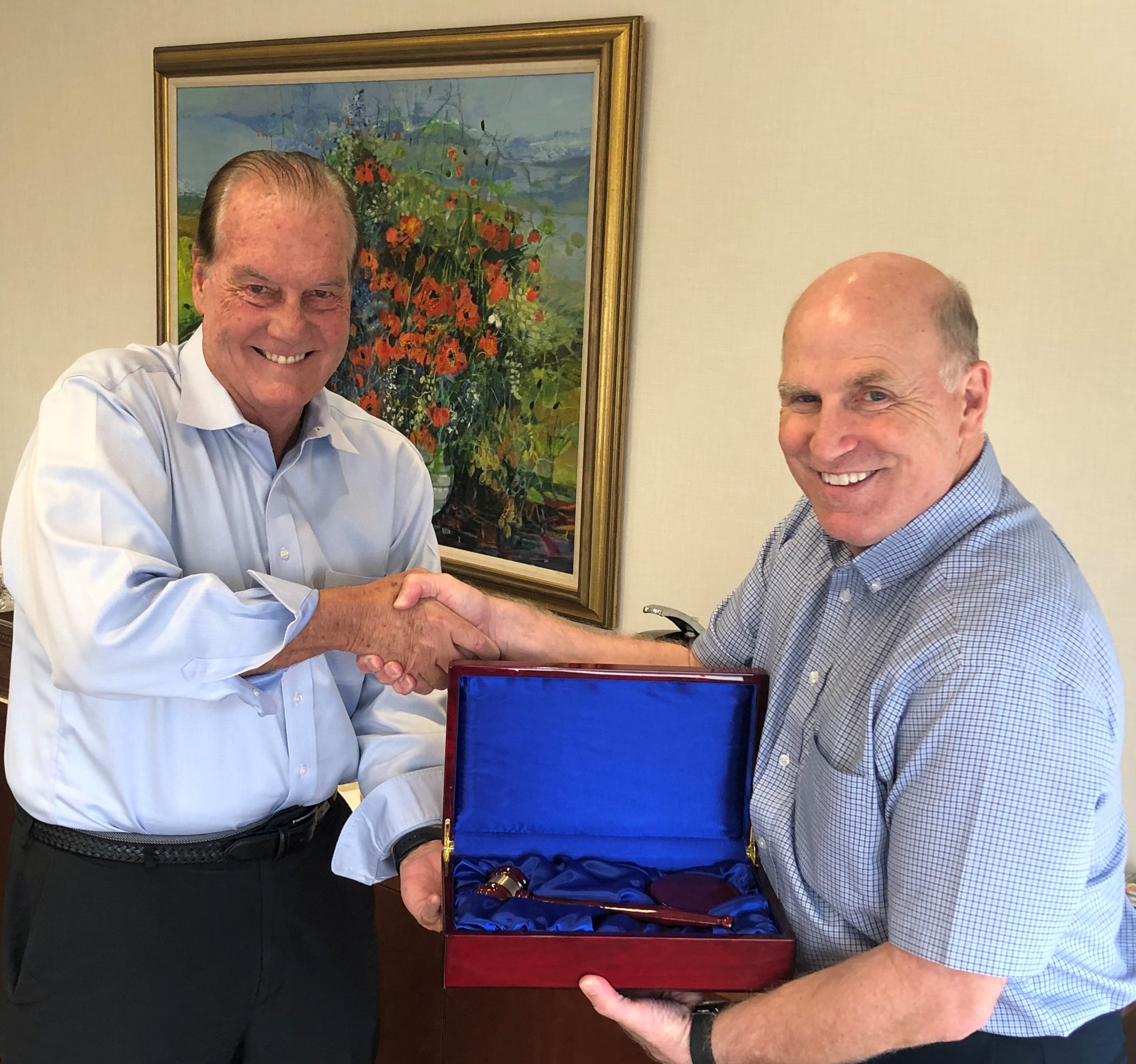 Mike Martella (rt), the Van Wezel Foundation’s immediate past board chair and current Vice-Chairman, passes the gavel to newly elected chair, Jim Travers.