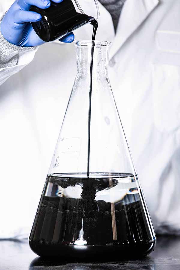 A liquid composed of fine particles of colloidal activated carbon (1-2µm) suspended in water.