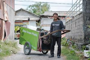 Plastic Bank collection member with his collection cart