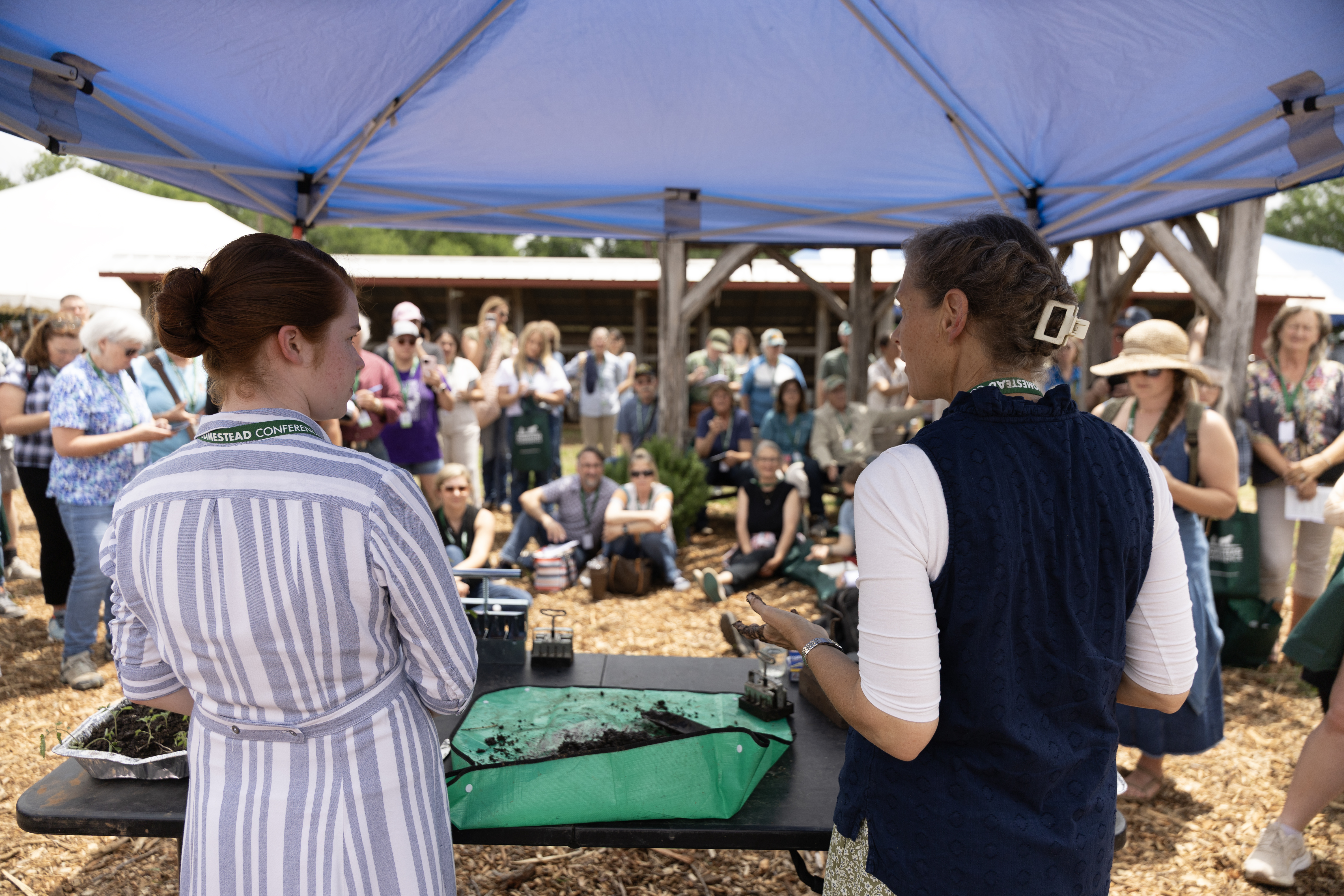 Sarah Wiley and Amy Brydon demonstrate transplanting techniques