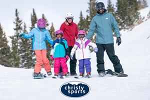 Family on the ski slopes with season rental gear from Christy Sports