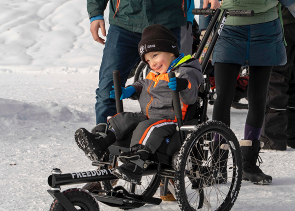 Through the 2021 Challenged Athletes Foundation grant distribution, Teddy Wallace, 3, received a customized all-terrain GRIT Freedom Chair to explore the outdoors with this family. 