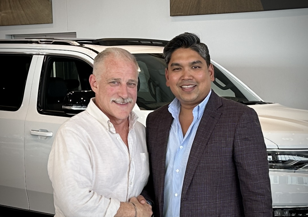 Pictured left to right: Tim Wild, Director of the Midwest and Plains Region for the Tim Lamb Group shakes hands with Raj Clement, Owner and President of Clement Auto Group after closing on the purchase of the Marty Cancila Dodge Chrysler Jeep Ram dealership which took place on September 16, 2024.