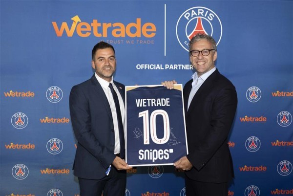 EU Wetrade’s CEO George Miltiadou (left) signs partnership with Paris Saint-Germain's Chief Revenue Officer, Richard Heaselgrave.