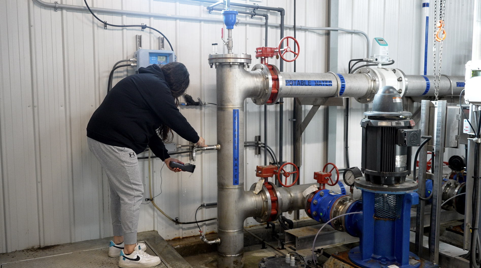 Water First Intern conducts in-house testing on treated water to ensure key water quality parameters are met