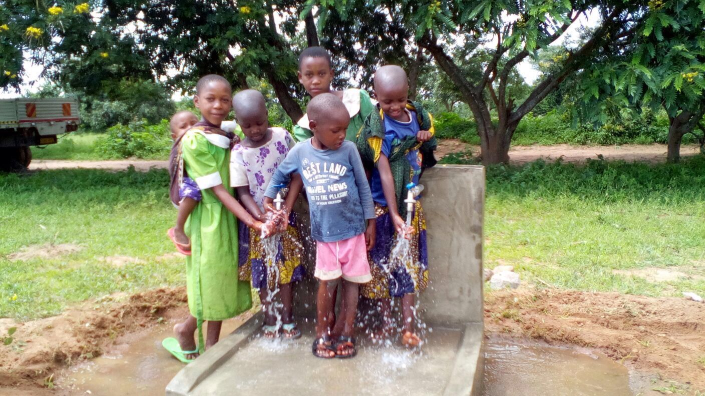 Children test out the new well