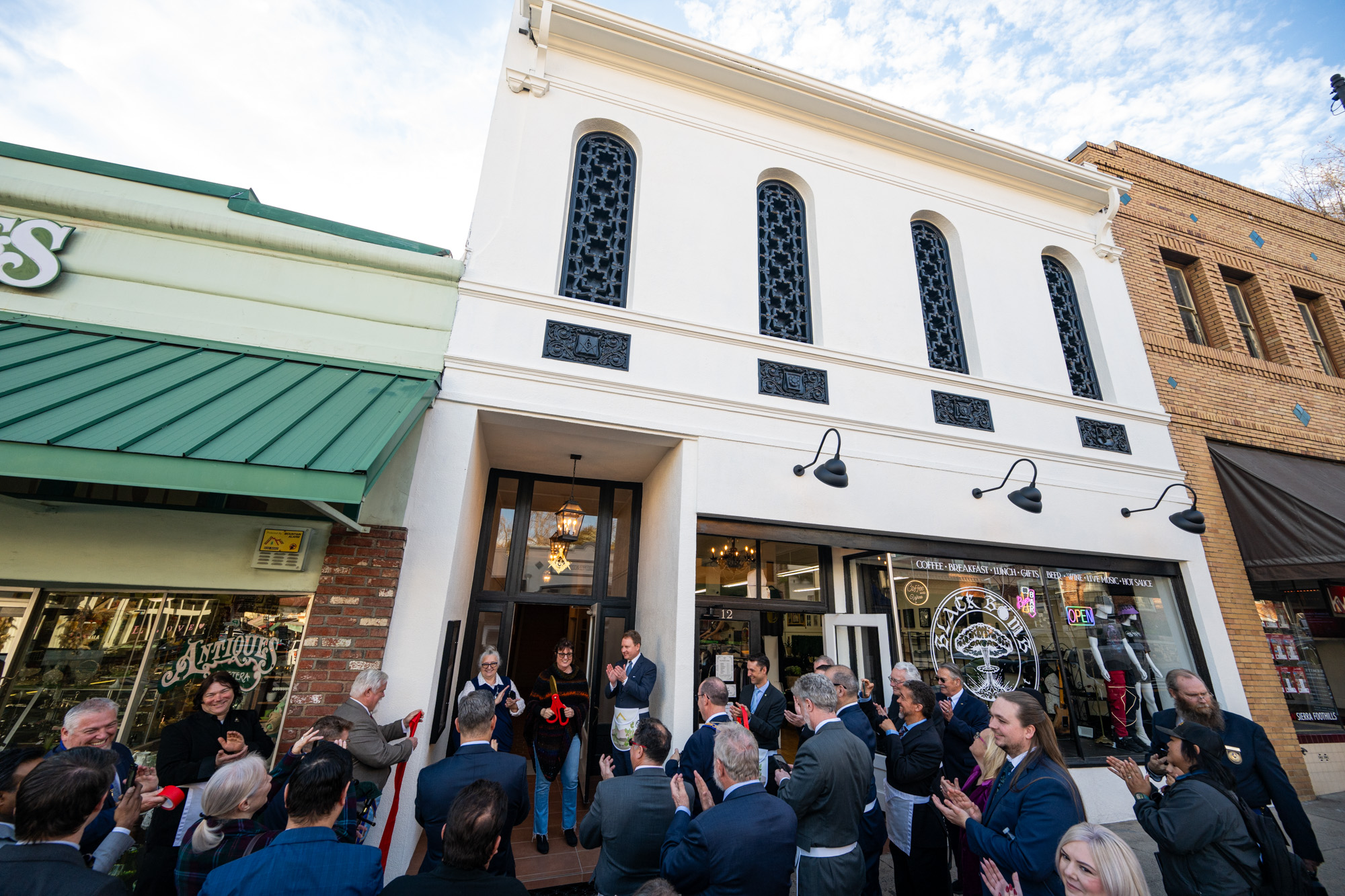 Members of Sonora Lodge No. 887 and members of the community participate in a ribbon-cutting ceremony with Katie Dunn, president of the Sonora Chamber of Commerce, for the rededication of the newly-renovated historic (c. 1873) Sonora Masonic Temple on Saturday, February 22, 2025 in Sonora, Calif.